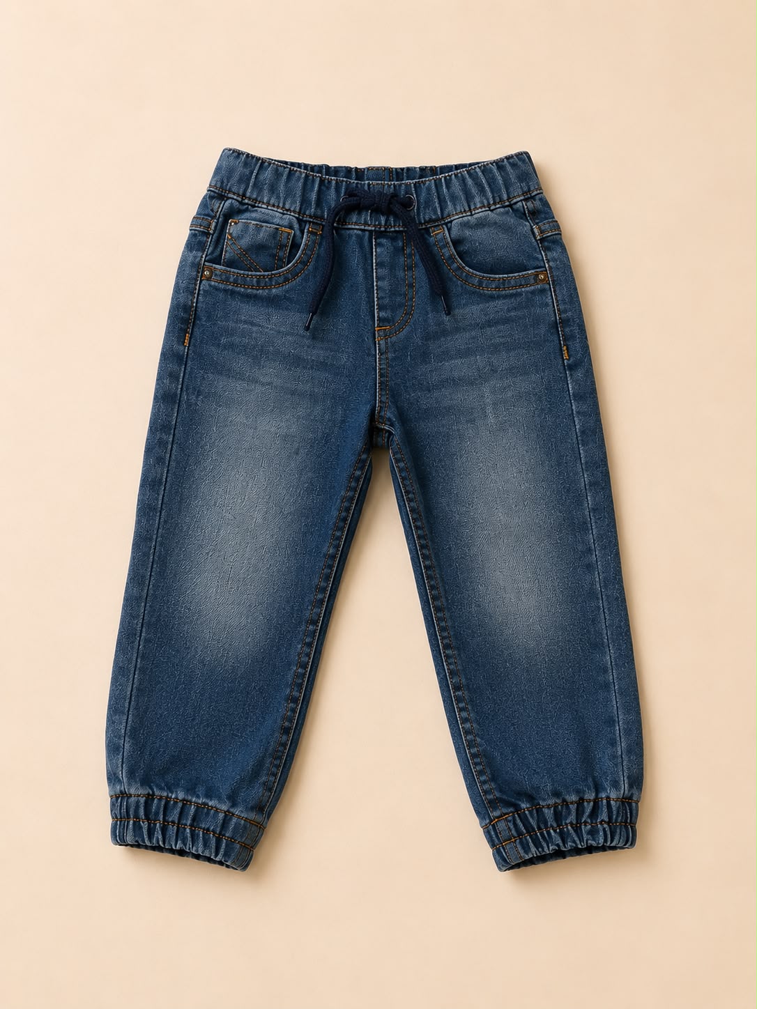 Pantalón vaquero de bebé con puño elástico