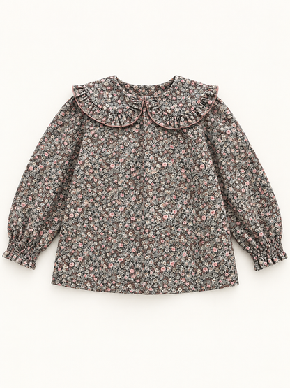 Blusa de niña con flores y cuello redondo