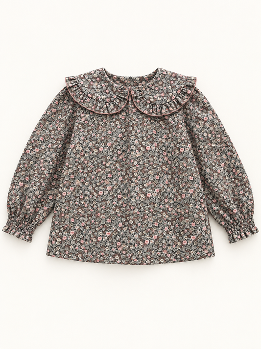 Blusa de niña con flores y cuello redondo