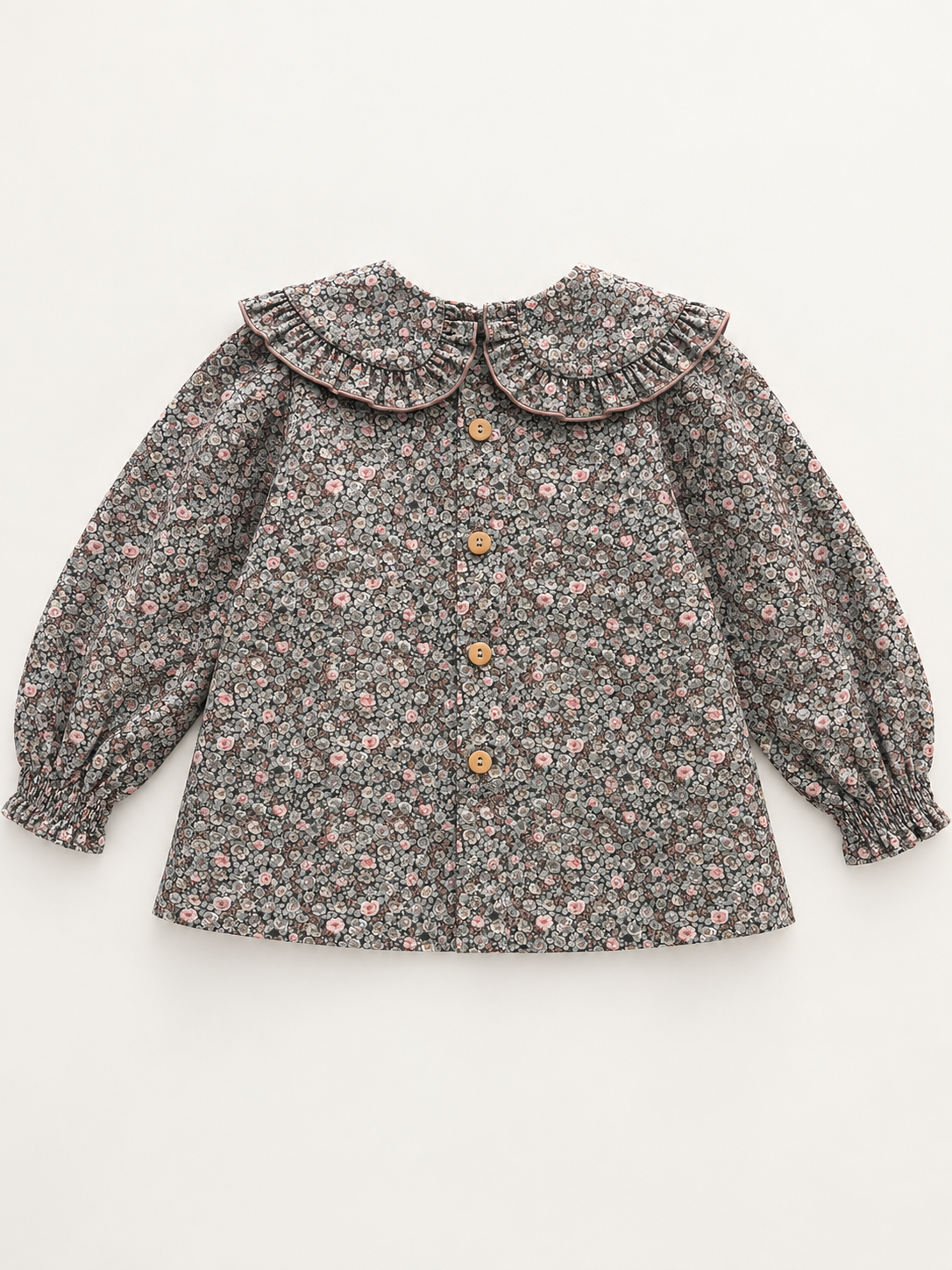 Blusa de niña con flores y cuello redondo